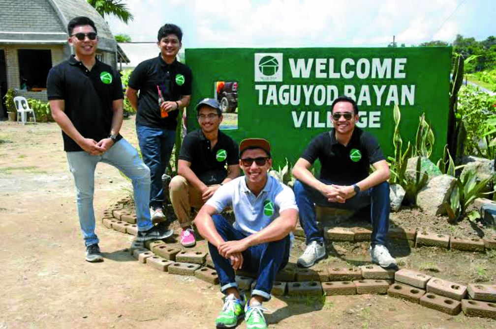 THEY BUILD HOUSES, DON’T THEY? Five of the seven “snotnosed, spoiled Ateneans,” as one consultant described them, are all smiles during the turnover of the houses they built for displaced Iloilo families at Taguyod Bayan Village. They are (from left) Mico de Guzman, Stu Balmaceda, Miguel Gutierrez, Rich Lopa and Don Agudo. PHOTO COURTESYOF TAGUYOD BAYAN FOUNDATION INC.