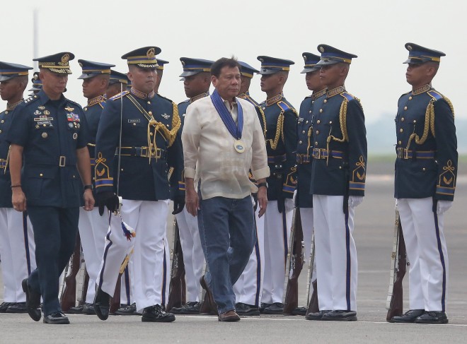 GROOVY PRESIDENT DUTERTE / JULY 5,2016 President Rodrigo Duterte in wears a maong pants and folded sleeves of barong troops the line during the 69th founding anniversary of the Philippine ?Airforce held in Clark airbase, pampanga. INQUIRER PHOTO/JOAN BONDOC