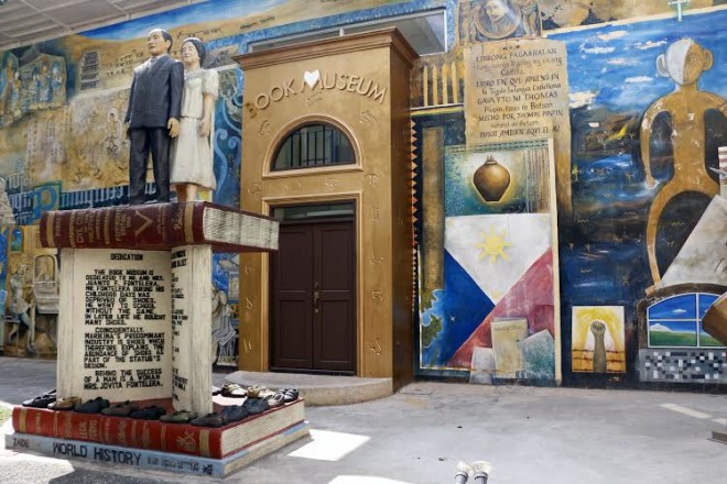 FAÇADE of the Book Museum features a hand-painted mural showcasing the history of book printing and publishing.