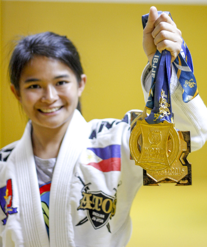WORLD CHAMPION. Ochoa shows off her three gold medals won in competition.