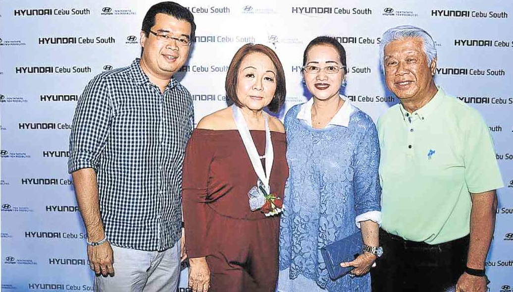 HYUNDAI Cebu treasurer Margarita Onglatco (center) greeted on her birthday by (from left) Ritchie Go and his parents Babie and Ricardo