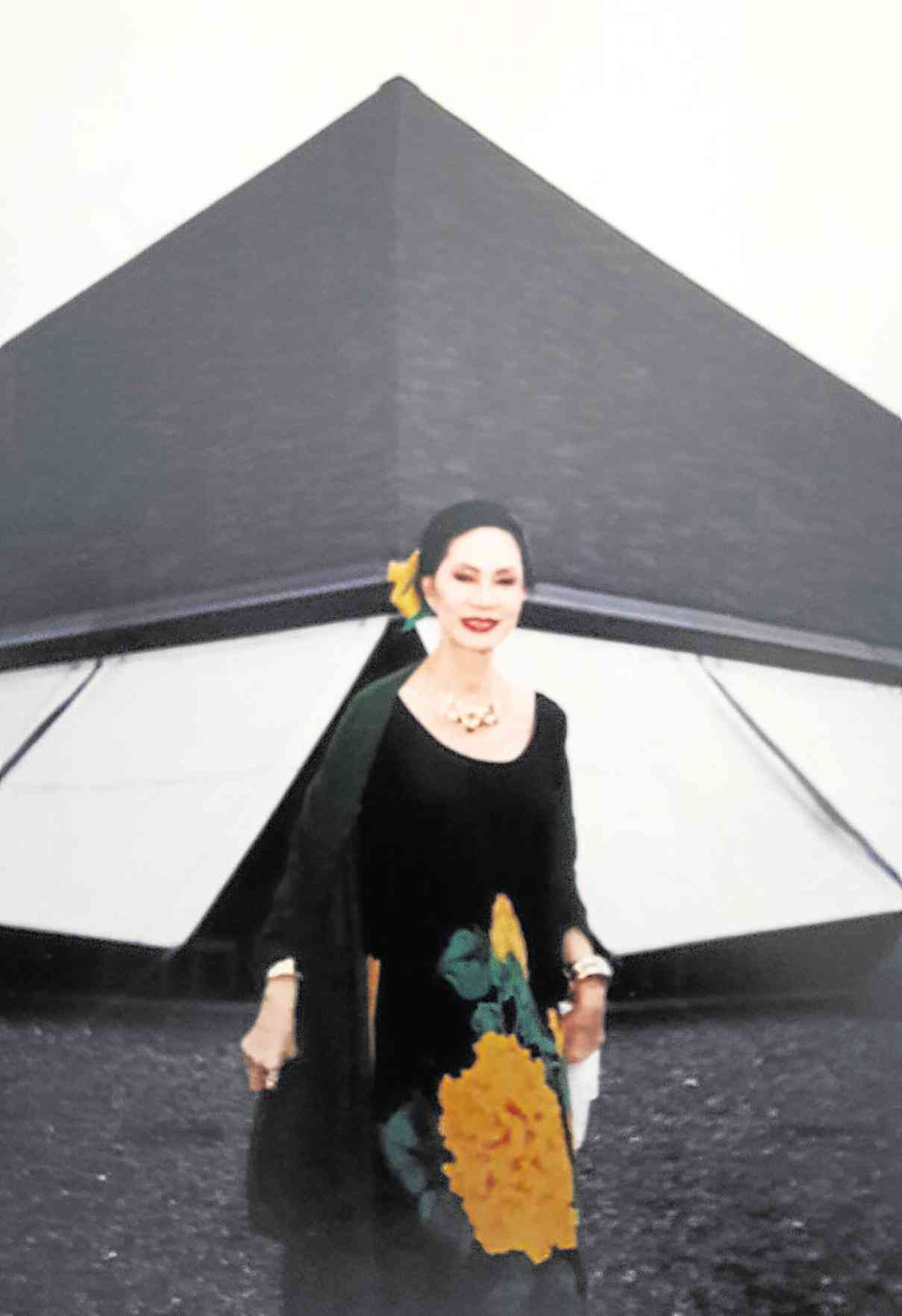 MELDY Cojuangco in front of the Church of the Transfiguration designed by National Artist Leandro Locsin