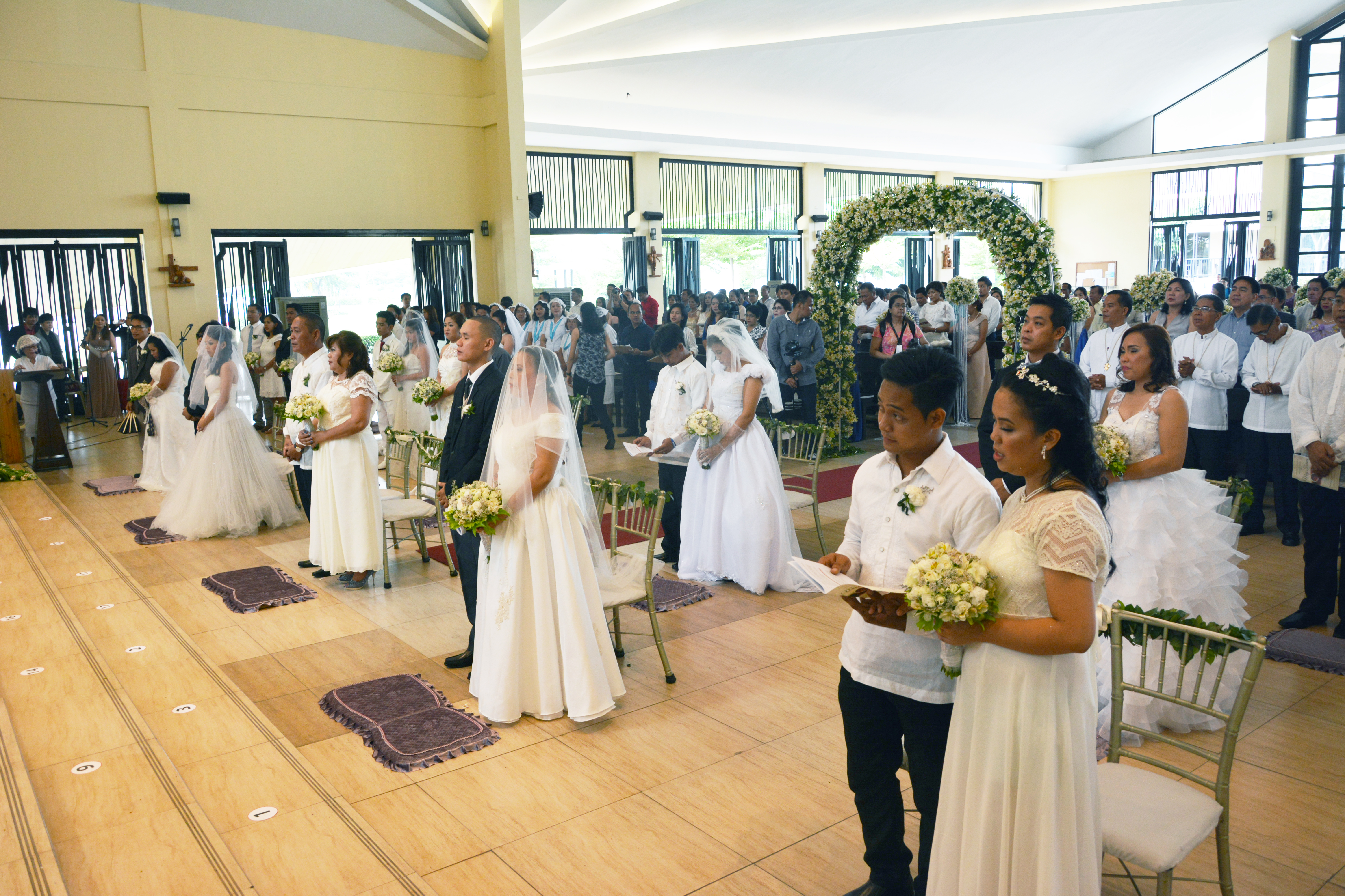The seventeen couples of May Forever: Kasalan sa Lancaster New City, took their assigned seats after the walk down the aisle. Venue: Church of the Holy Family, Lancaster New City Cavite.