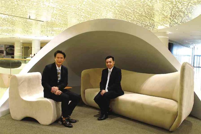 STEVEN Tan and Perkins So of SM Supermalls sit in one rest space that resembles a pod.