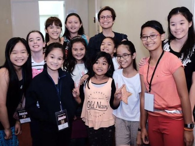 Lea Salonga, the original Annie in the Repertory Philippines production  of the musical  in 1980, visits the kiddie cast of Resorts World Manila’s “Annie.” PHOTO COURTESY OF BIANCA ARANETA-ELIZALDE
