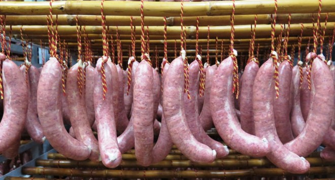“EMBUTIDO,” or pork sausages, at the Faccsa Prolongo factory in Malaga. Notice the strings in the Spanish colors of red and yellow.