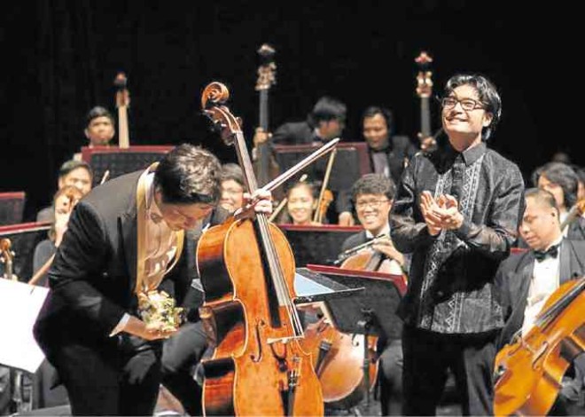MAESTRO Darrell Ang with cellist Isang Enders at the end of the Shostakovich concerto