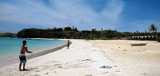 TOURISTS play on the vast white sands of Calaguas beach in CamarinesNorte after two tons of trash were disposed of. PIPO LOS BAÑOS/CONTRIBUTOR