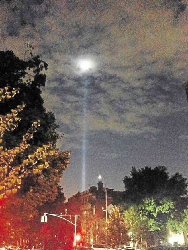 “TRIBUTE in Light” looms high above Park Slope in Brooklyn and throughout New York City. The art installation ismade up of 88 searchlights placed next to the site of what was the Twin Towers. SOPHIA G. ROMERO