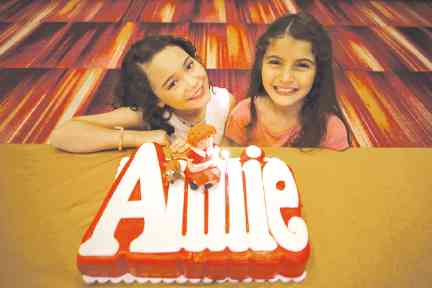 KRYSTAL Brimner and Isabeli Araneta Elizalde alternate as Annie.