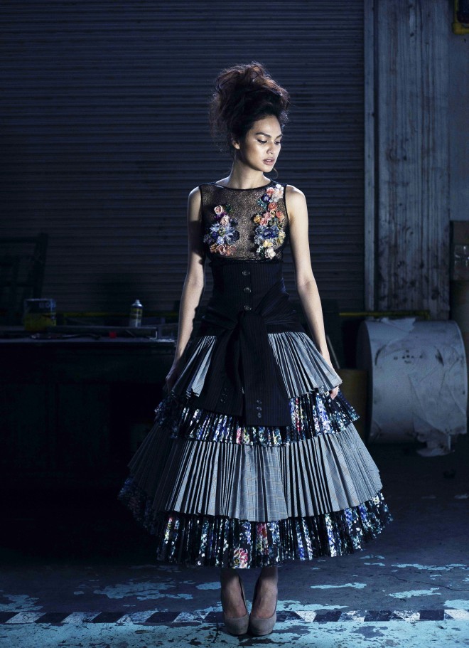 REYMUND CLARIDAD Electric-pleated taffeta and organza are layered into a “new look” silhouette. Waist is accentuated with deconstructed men’s suit.
