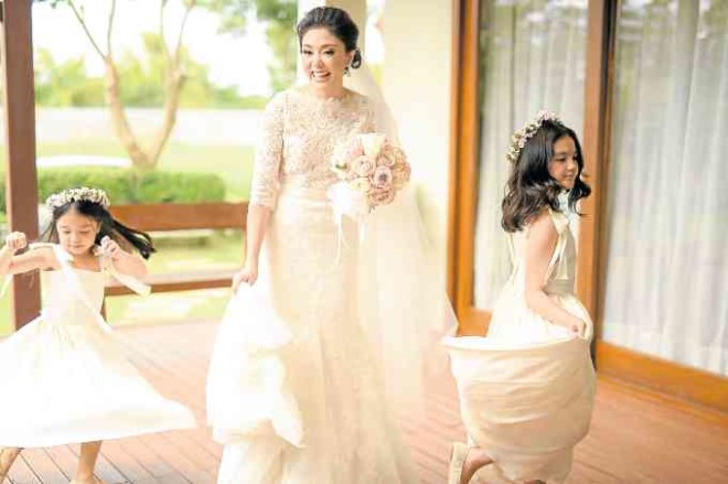 The bride dancing with her daughters
