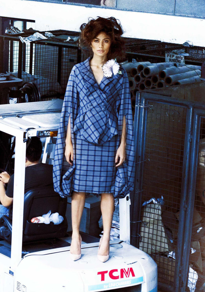 REYMUND CLARIDAD Pouf dress constructed using only one continuous piece of fabric, draped from the back to form the jacket and skirt at the front.