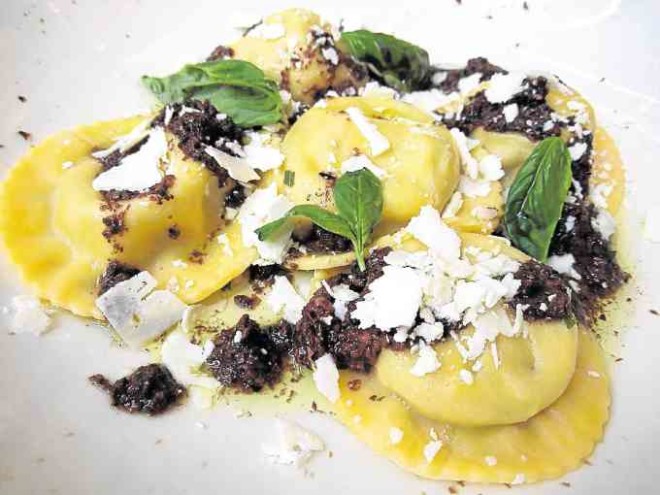 Goat Cheese and Scallion Ravioli with black olive tapenade and butter sauce