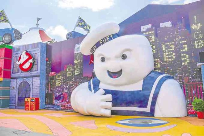 Stay Puft, the iconic Marshmallow Man from the original movie, greets visitors prior to entering Ghostbusters HQ.