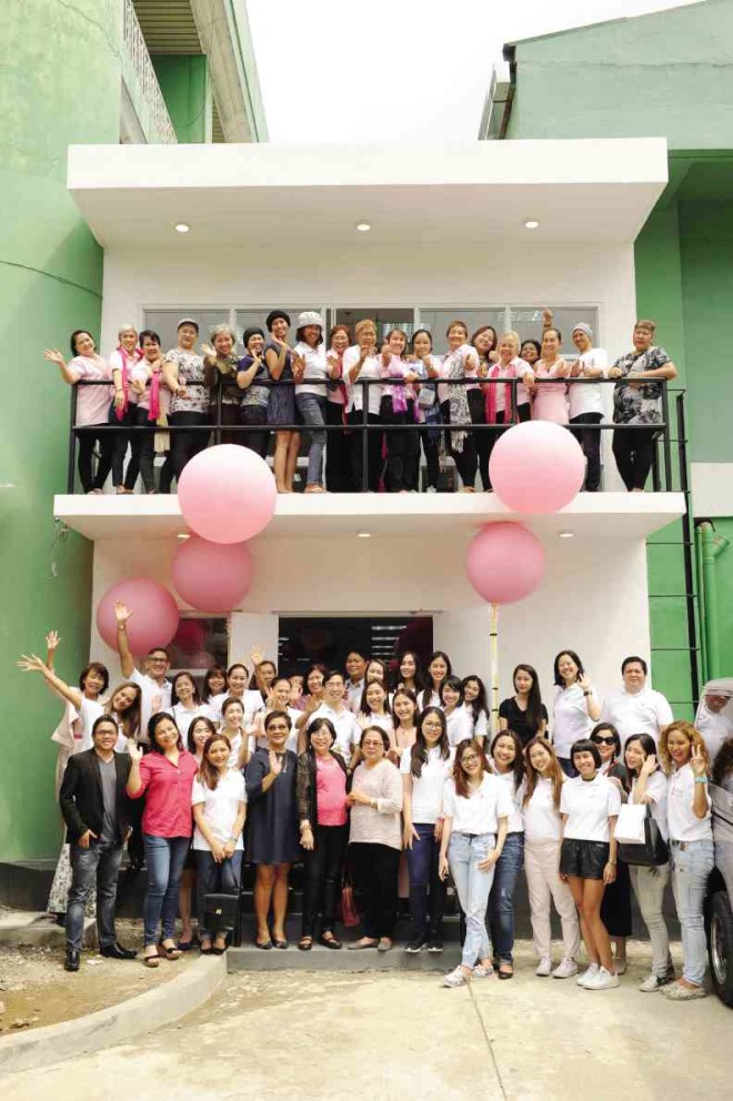 Partners from Pink for Life, Philippine Foundation for Breast Care Inc., Estée Lauder and The Peninsula Manila at the entrance to the Breast Care Center Annex