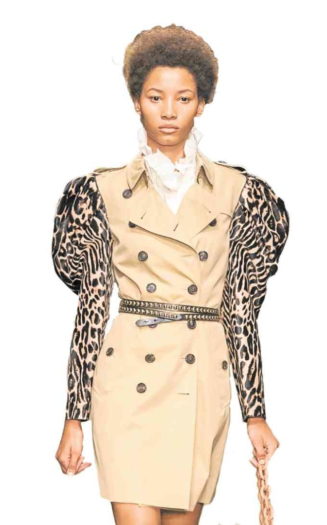 TRENCH COAT Burberry’s structured animal print sleeve and ruffled blouse is the latest way to wear the khaki jacket.