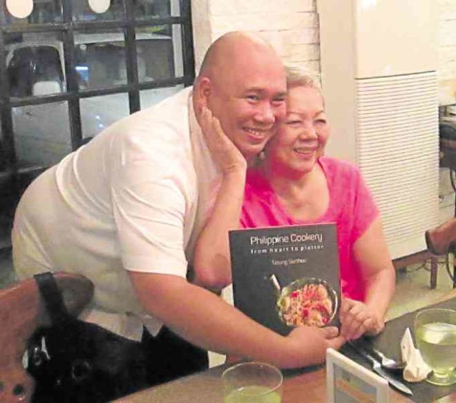 Gilda Cordero Fernando with chef Tatung Sarthou and his book “Philippine Cookery”