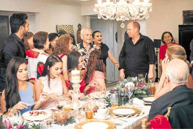 Newlywed couple Dr. Danny and Baby Vazquez attend to guests at dinner for Miss World pageant officials.