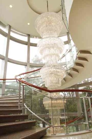 The oversized Italian crystal chandelierwas customized for the spiral staircase. The scale dramatizes the space.