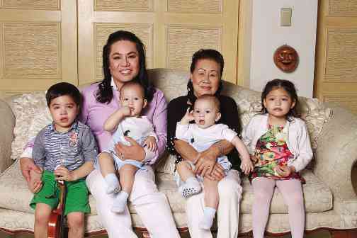 Joel Cruz and his mother, Milagros, with the two sets of twins, Prince Sean, Prince Harry, PrinceHarvey and Princess Synne