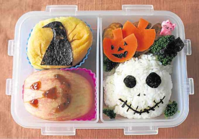 ‘Nightmare Before Christmas’ theme with Jack Skellington rice ball, chicken crispers, carrot pumpkin coins, broccoli, Jack o’ Lantern applewedge with strawberry jam, “yema” pastel bread with Oogie Boogie nori