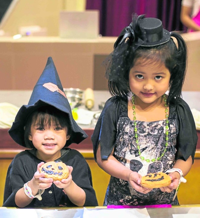 Spookfest participants can create unique designs using Halloween-themed bright orange, black and green icing