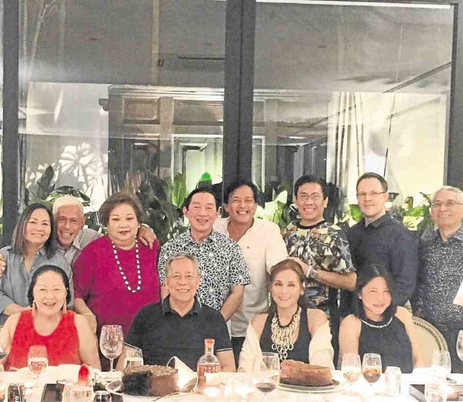 Conrad Onglao, center, inwhite shirt, with his friends at “move-on dinner” he hosted in his home; as it turned out, he kept the hope that he and Zsa Zsa would still get back.