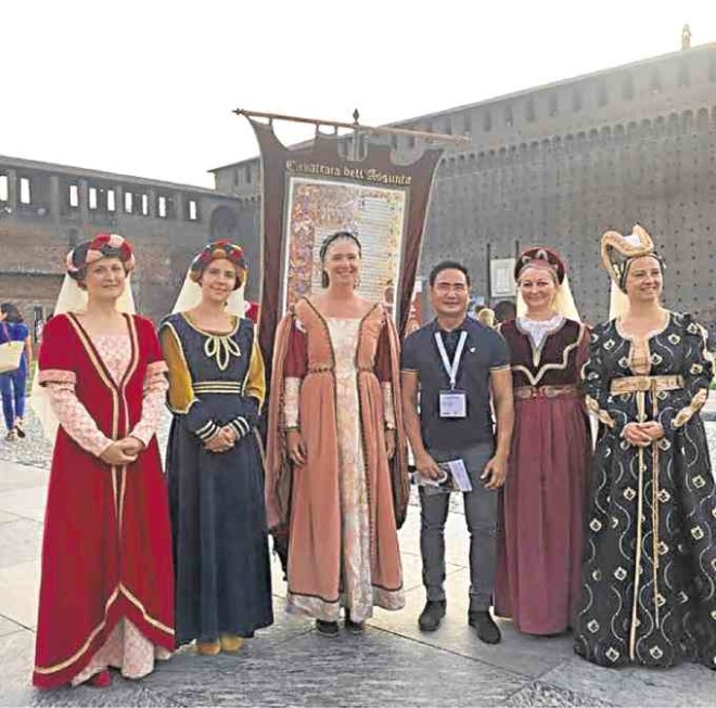 Author at the center of models dressed in Renaissance costumes at Sforza Castle