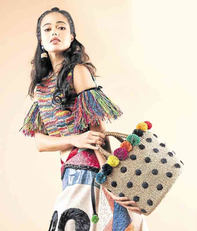 BonBon is an embroidered abaca bucket bag with handmade pompoms and braided leather handles -PHOTOS BY JOHN PAUL AUTOR