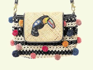 The ToucanChi, a unique slingmade with handwoven wood beads with toucan embellished flap and pom-poms
