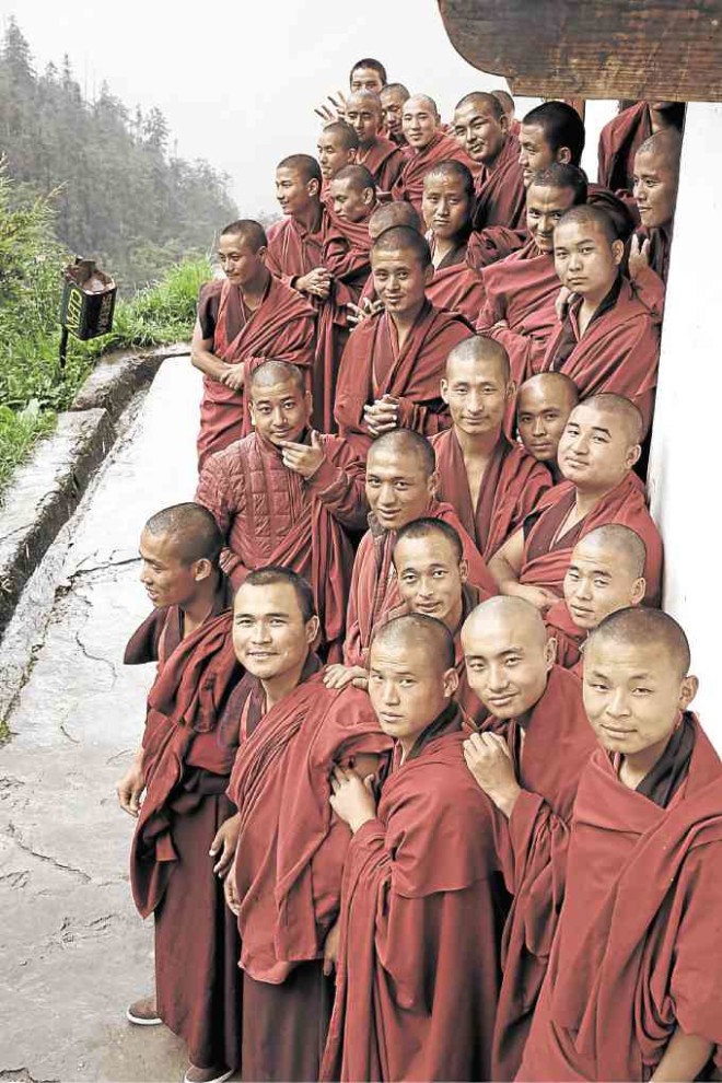 Monks lined up in the happiest place in all of Bhutan