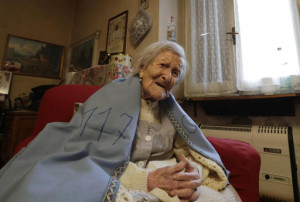 Emma Morano wears a sheet reading 117, in the day of her birthday in her home in Verbania, Italy, Tuesday, Nov. 29, 2016. At 117 years of age, Emma is now the oldest person in the world and is believed to be the last surviving person in the world who was born in the 1800s, coming into the world on Nov. 29, 1899. AP