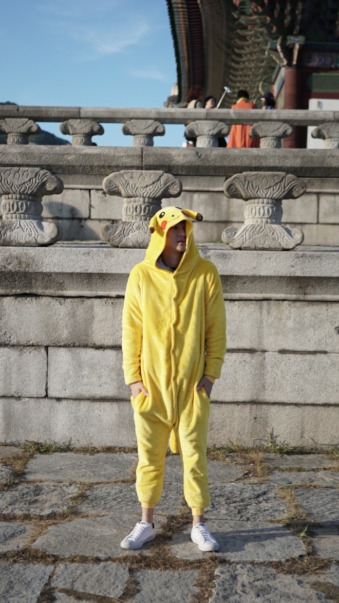 Richard Juan trying out his "Pikachu" onesie in Korea  