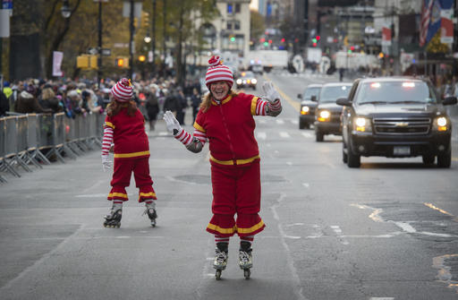 Performers skate along Central Park South before the Macy's Thanksgiving Day Parade, Thursday, Nov. 24, 2016, in New York. (AP Photo/Bryan R. Smith)