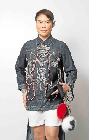 Jun Jun Ablaza in a denim coat with real diamonds and pearls from his mother's collection. The ear curve caps the look.