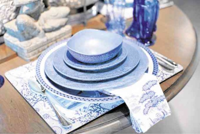 Stoneware plates in sapphire blue were made in Ilocos and have a matte glaze. Each four-piece set consists of a dinner plate, salad plate, soup bowl, and bread and butter plate.