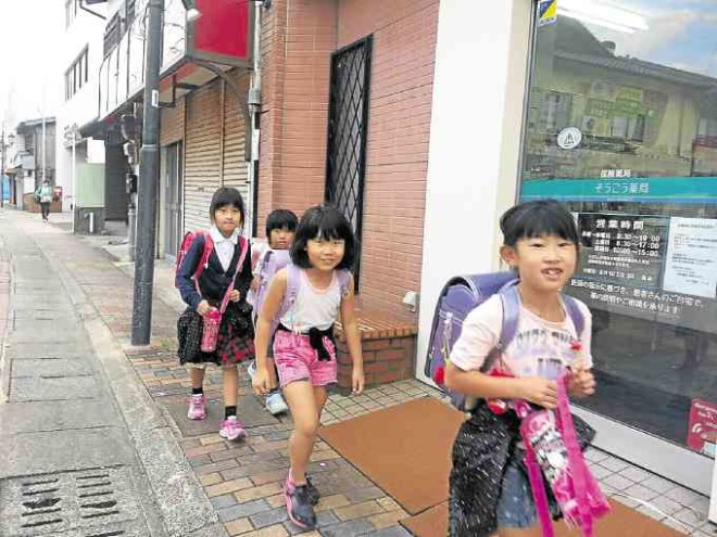 Japanese school kids in “randoseru” or backpacks