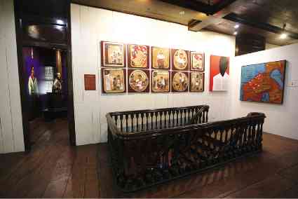Robert Alejandro’s artworks on the 10 commandments of the Katipunan line the wall past the staircase.