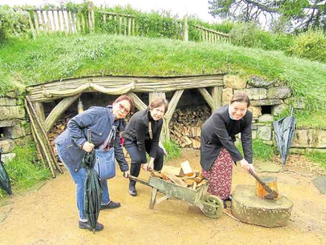 Filipino tourists at play in the The Shire, the idyllic mythical home of the Hobbits