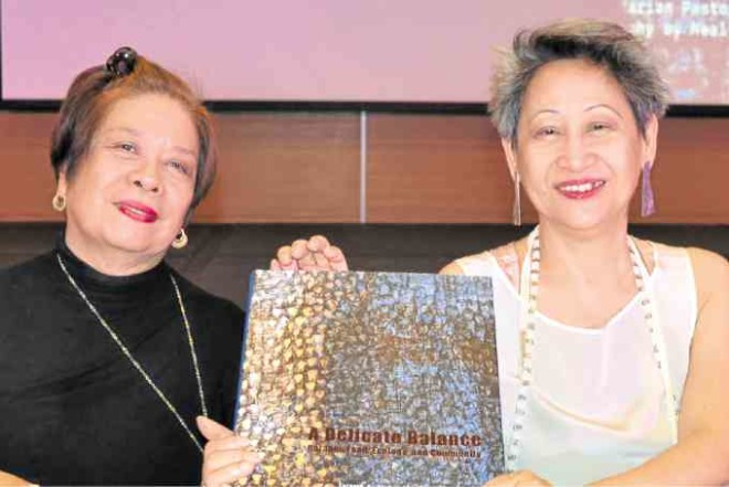 Alvina (left) and Roces holding their book —EDGAR ALLAN M. SEMBRANO