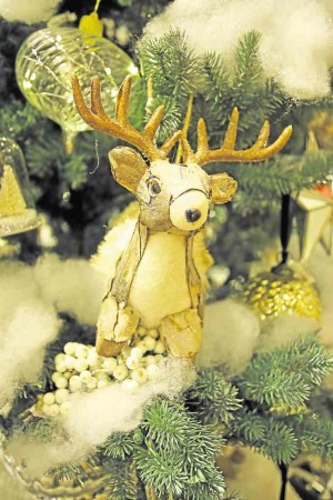 Reindeer, glass ornaments and faux snow for added magical feel