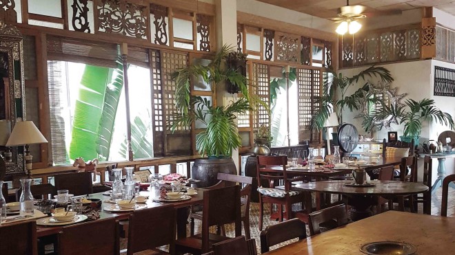 The dining room of Camiña Bahay na Bato inIloilo city exemplifies the Ilonggo lifestyle—take things slowly, enjoy the food (and eat lots of it), and appreciate the good life.