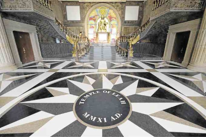 Sun pattern on the flooring and shrine leads to the formal staircase.