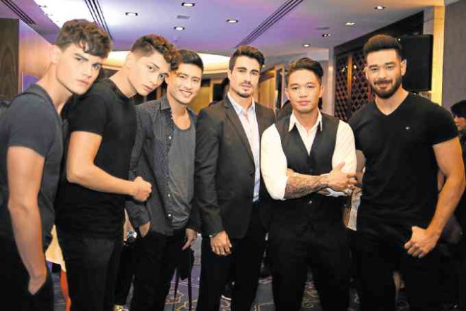 StylistMark Bustos (second from right)with male models at the launch of Bench Barbers