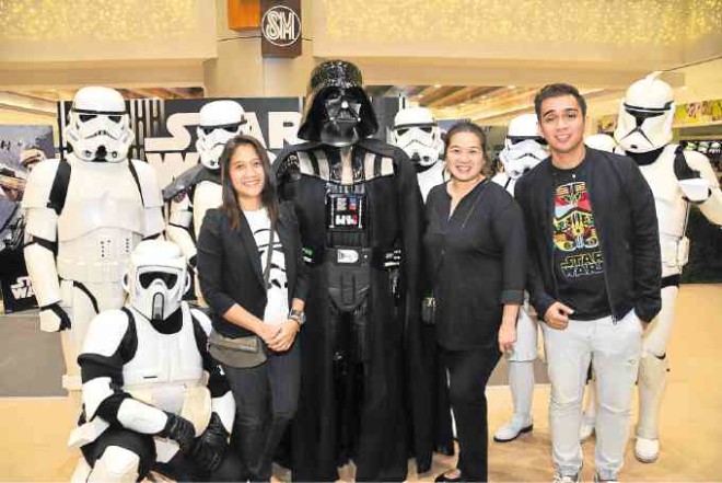 Toy Kingdom SAVP BernieMaMon Luk-Chua and AVP Pearl DatileswithWalt Disney Philippines retail manager Randy Reyes