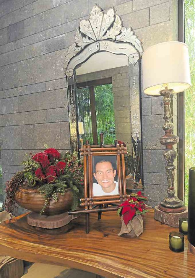 At the foyer of themain house and also in the family room, son Joel,who died in 2007, is lovingly remembered through large framed portraits.