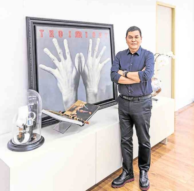 Ben Chan collects Ronald Ventura’s artworks. This painting of hands is a “feng shui” symbol of the ability to grasp the future and work hard. "It looks photographicwith R-I-G-H-T spelled backward,” says Chan.