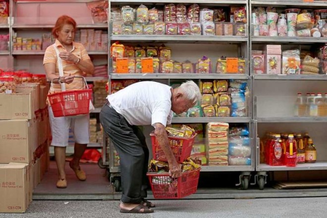 Mr Foo buys provisions from Ang Mo Supermarket in Ang Mo Kio to replenish his stock. The 78-year-old usually does this on his day off on Saturday. He says he likes this shop because it has almost everything he needs. WANG HUI FEN/THE STRAITS TIMES/ASIA NEWS NETWORK