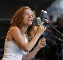 In this May 6, 2012 file photo, Ani DiFranco performs with the Preservation Hall Jazz Band at the New Orleans Jazz and Heritage Festival in New Orleans. AP